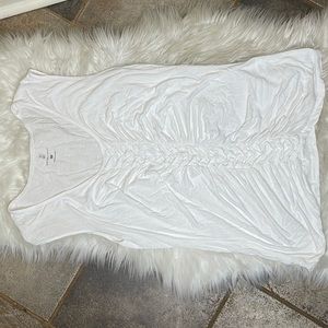 White sleeveless shirt with a pleated middle
